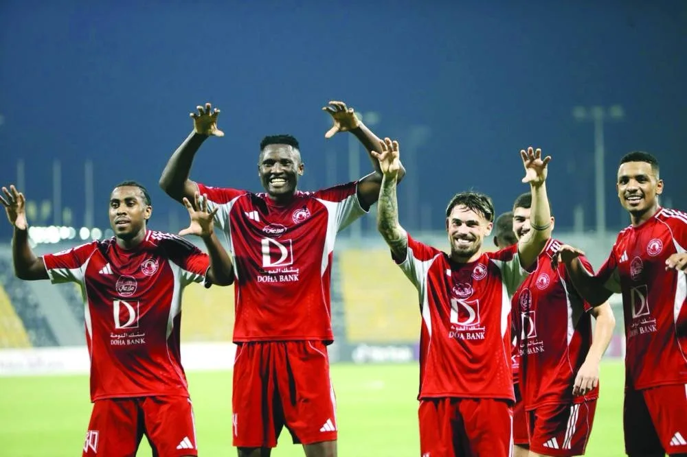 Al Arabi players celebrate their 5-1 win over Qatar SC Sunday.