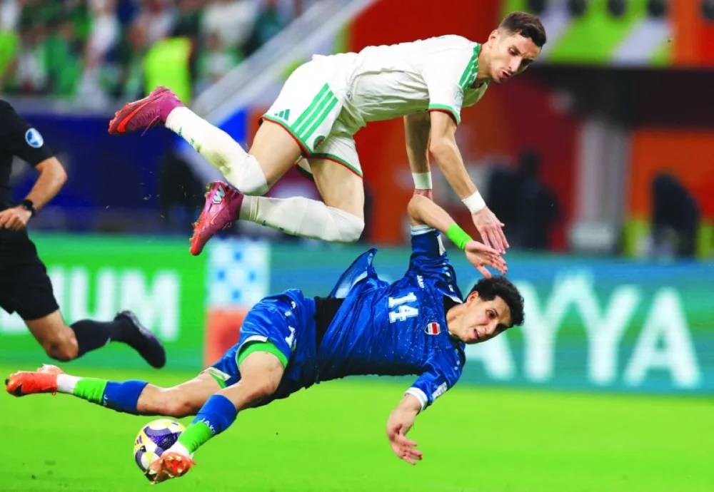 Soccer Football - FIFA Arab Cup - Qatar 2025 - Group D - Algeria v Iraq - Khalifa International Stadium, Doha, Qatar - December 9, 2025
Algeria&#039;s Adil Boulbina in action with Iraq&#039;s Sajad Jassim REUTERS
