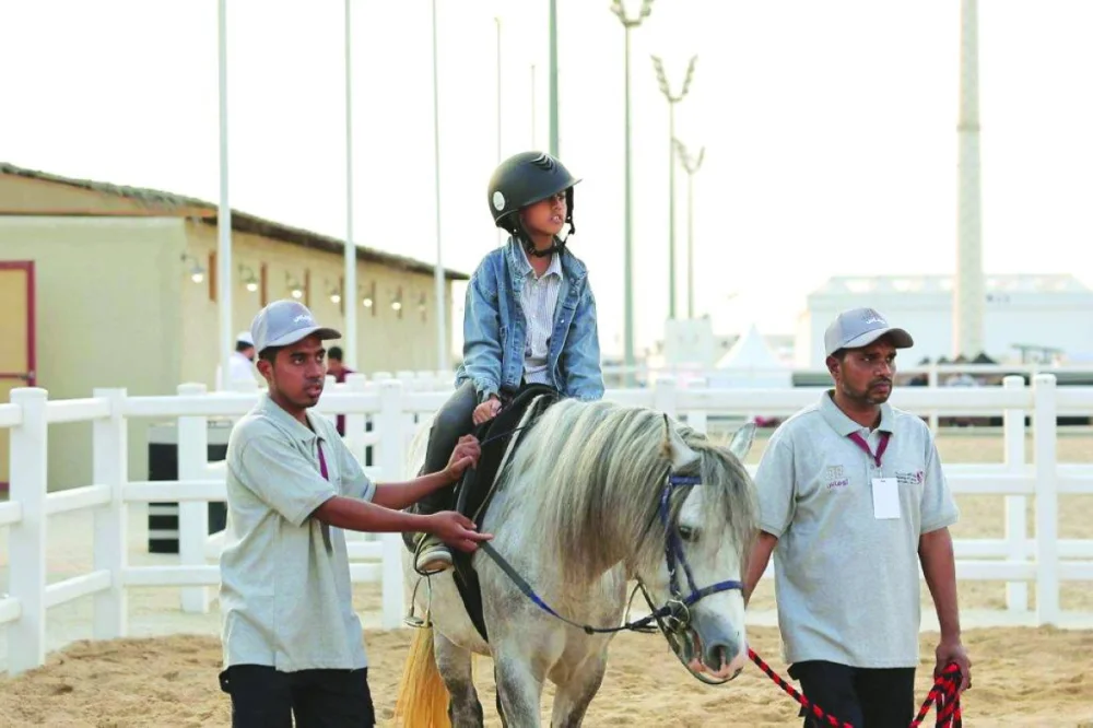 A young rider with two mentors.