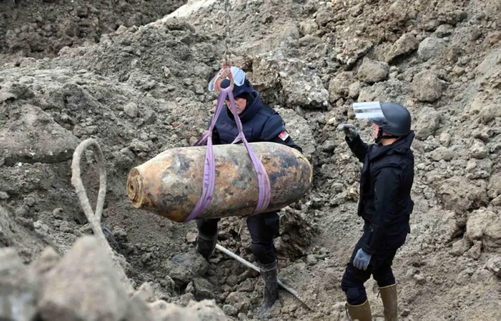 This handout photograph taken on December 28, 2025, and released by Serbia's Ministry of Interior, shows Serbian bomb disposal experts removing a 470-kg World War II aerial bomb, dropped on Nazi-occupied Belgrade in 1944, from a construction site in the Serbian capital. A 470-kilogram (1,000-pound) World War II aerial bomb was safely removed on December 28, 2025 from a construction site in the wider central area of Serbia’s capital, Belgrade, police said.
The US-made AN-M44 bomb was used during Allied air raids on German positions during the liberation of Belgrade from Nazi occupation in 1944. (AFP) The US-made AN-M44 bomb was used during Allied air raids on German positions during the liberation of Belgrade from Nazi occupation in 1944. (AFP) 