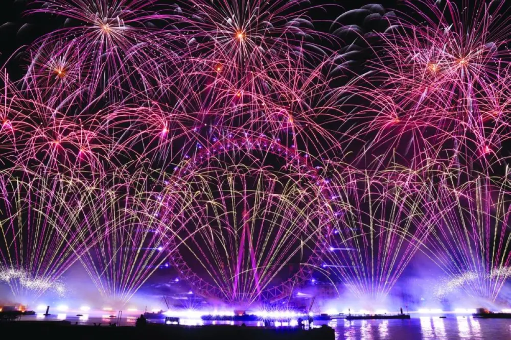 Fireworks explode over the London Eye Ferris wheel to mark the New Year's celebrations.
