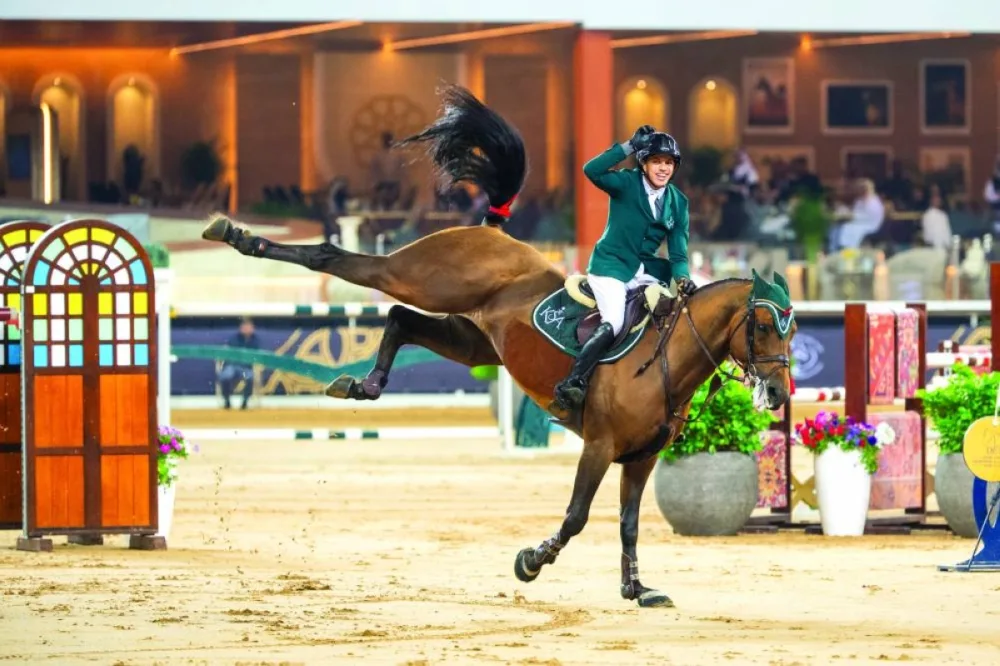 Saudi Arabia’s Abdullah Alsharbatly celebrates after clearing the final rail aboard Boeckmanns Lord Pezi Junio to win the CSI4
Jump-Off 1.50m class at the HH The Father Amir’s Prix at Al Shaqab Saturday.