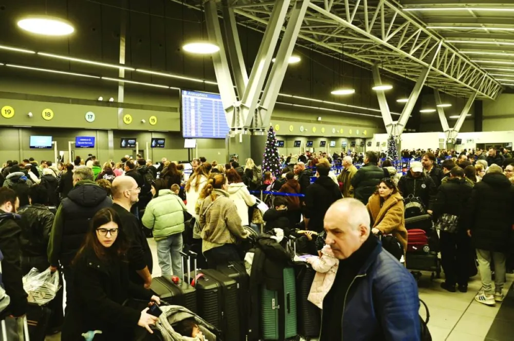 Passengers wait at the Thessaloniki Airport amidst disruption in flights across Greece linked to a technical problem at the Athens Flight Information Region (FIR). AFP
