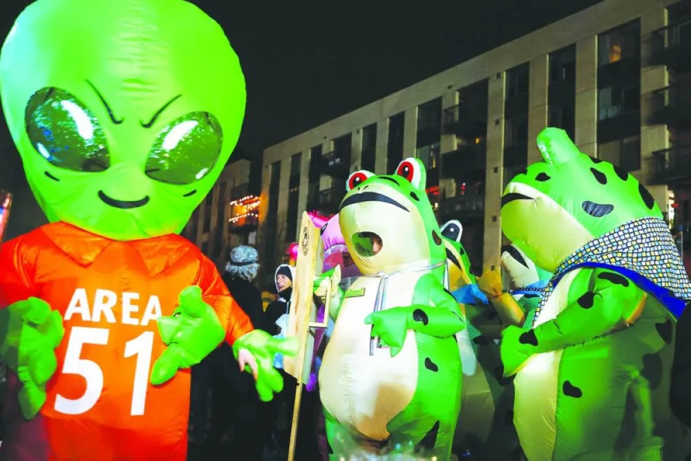 People wearing inflatable costumes demonstrate outside the Portland ICE facility. – Reuters