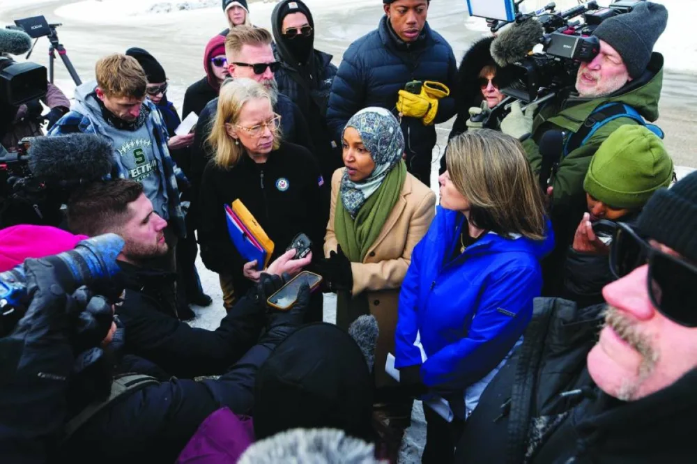 Lawmakers Ilhan Omar, Kelly Morrison and Angie Craig hold a press conference outside of the regional ICE headquarters at the Bishop Henry Whipple Federal Building in Minneapolis. – AFP