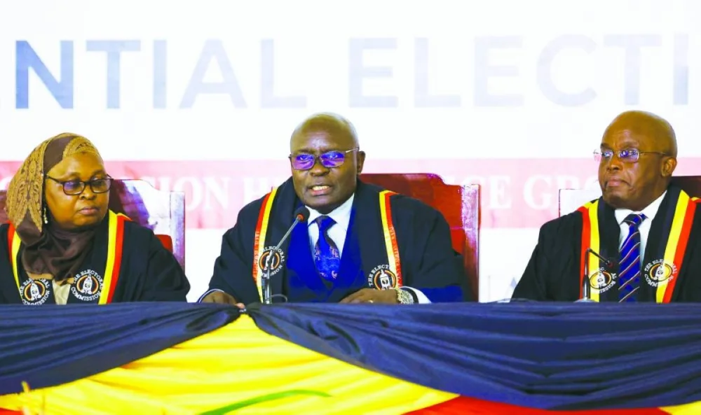 Ugandan Electoral Commission (EC) Chairperson Justice Simon Byabakama announces the final presidential results following the general elections at the Tally Centre in Lubowa, Wakiso district near Kampala, Saturday,