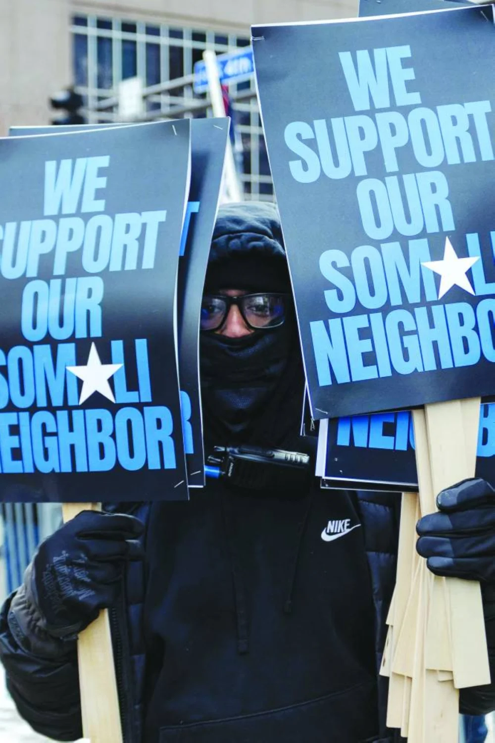 An anti-ICE protester stands near City Hall in Minneapolis, Minnesota. Protesters gathered after federal agents continued anti-immigrant enforcement dubbed ‘Operation Metro Surge’. – AFP