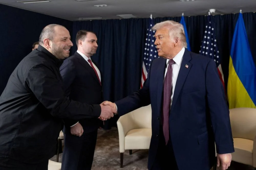 US President Donald Trump shakes hands with Secretary of Ukraine's National Security and Defence Council Rustem Umerov during a meeting at the sidelines of the 56th annual World Economic Forum (WEF), in Davos.