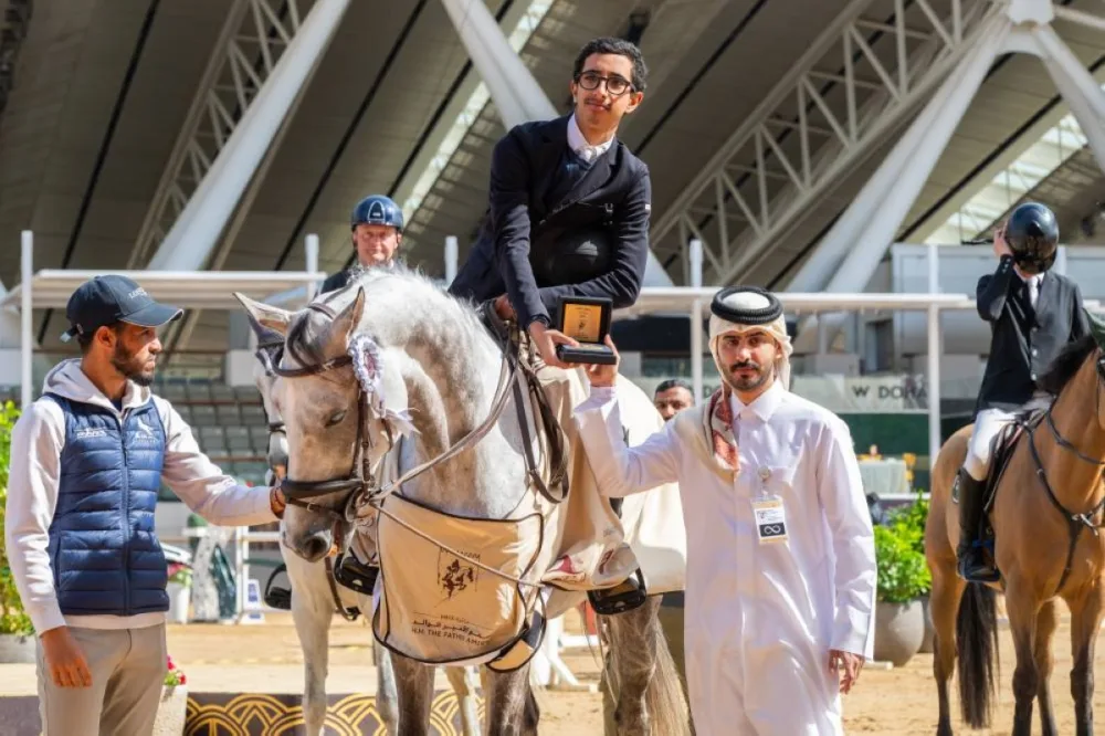 Abdullah al-Qashouti, Marketing and Communications Manager of the HH The Father Amir's Prix, presents the medal to Qatar’s Suhaim Hamad al-Yafei, who claimed top honours in the CSI3* Special Two-Phase 130cm.