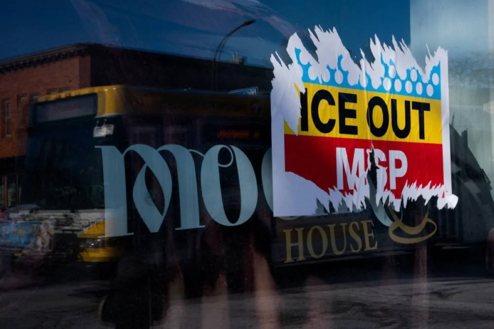 A sticker is partially torn off a storefront window of a closed business as civic leaders and labour unions launch a day of action and a general strike to oppose the US government's surge in immigration enforcement agents in Minneapolis. – Reuters