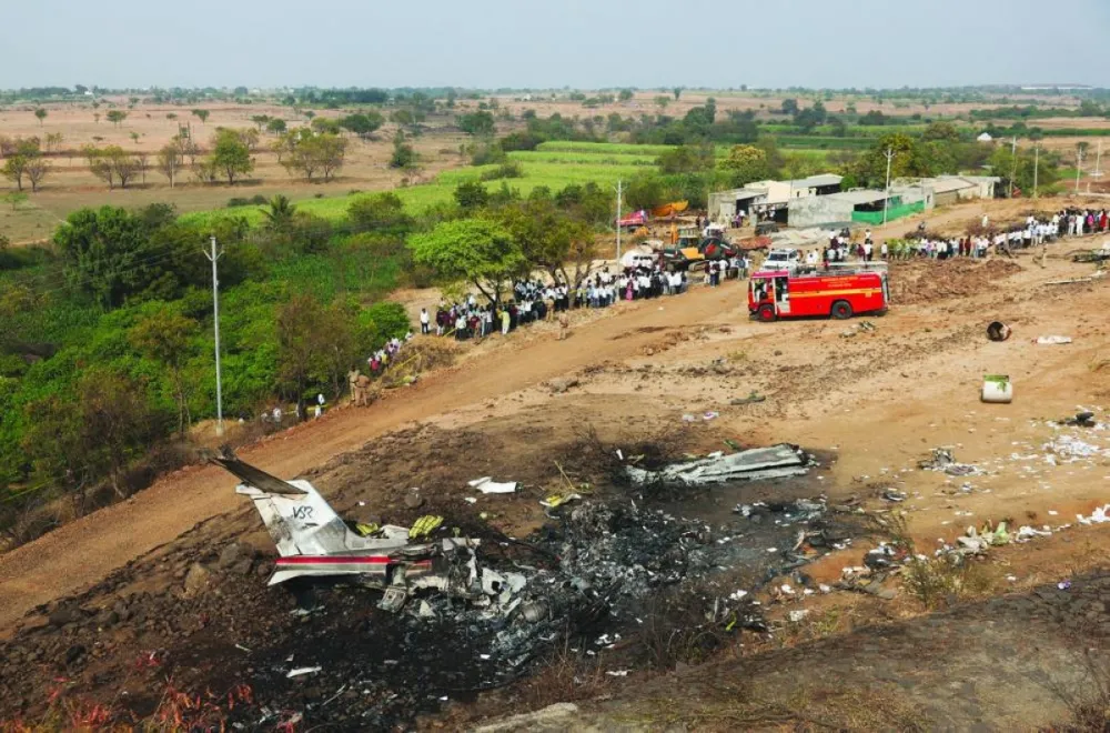 People look at the wreckage of the VSR Ventures-operated Learjet 45 aircraft in which Maharashtra Deputy Chief Minister Ajit Pawar and four others were killed after it crashed in Baramati, India, January 28, 2026. REUTERS