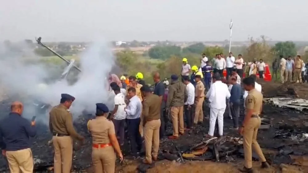 Emergency personnel and people gather at the site of a plane crash, in which Maharashtra's Deputy Chief Minister Ajit Pawar and four others were killed, in Baramati, Maharashtra, India January 28, 2026. REUTERS 