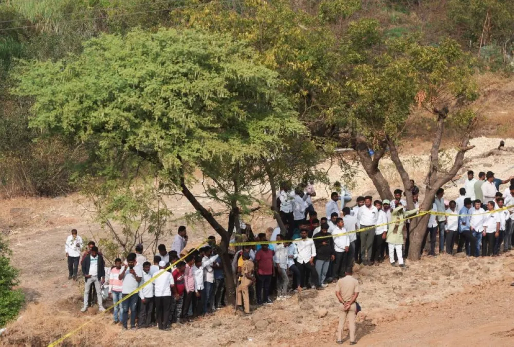 People look at the wreckage of the VSR Ventures-operated Learjet 45 aircraft in which Maharashtra Deputy Chief Minister Ajit Pawar and four others were killed after it crashed in Baramati, India, January 28, 2026. REUTERS