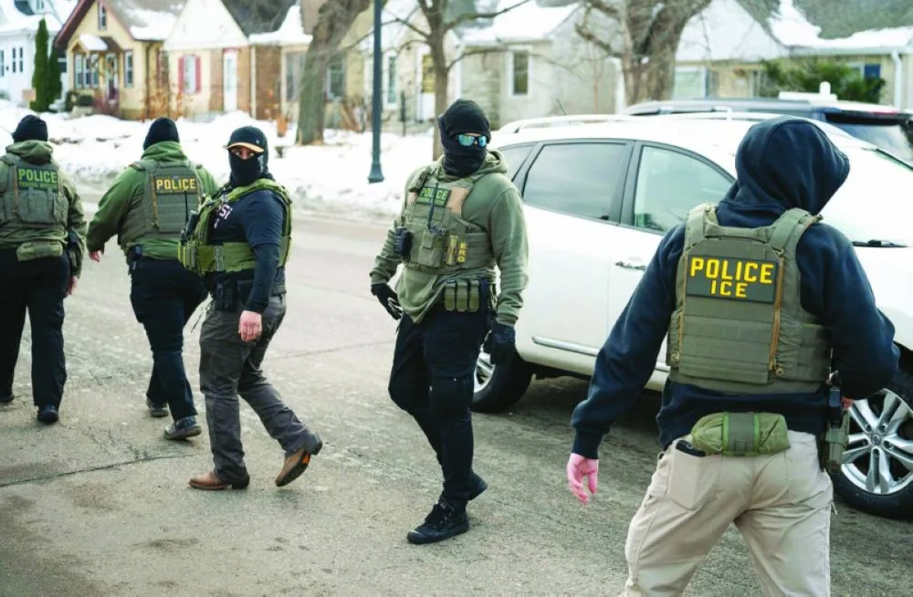 ICE agents leave an area after one of their vehicles got a flat tyre on Penn Avenue in Minneapolis. – AFP