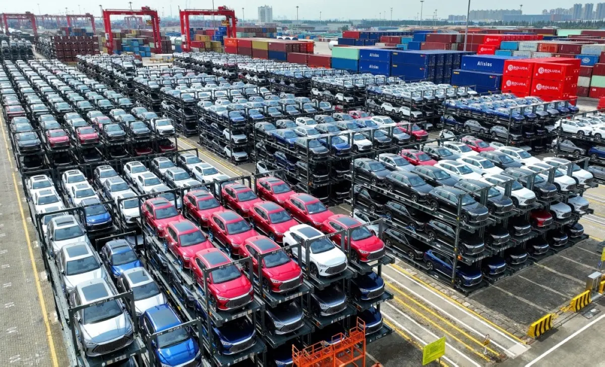 JIANGSU: In this photo, BYD electric cars waiting to be loaded on a ship are stacked at the international container terminal of Taicang Port at Suzhou Port, in China’s eastern Jiangsu Province. – AFP