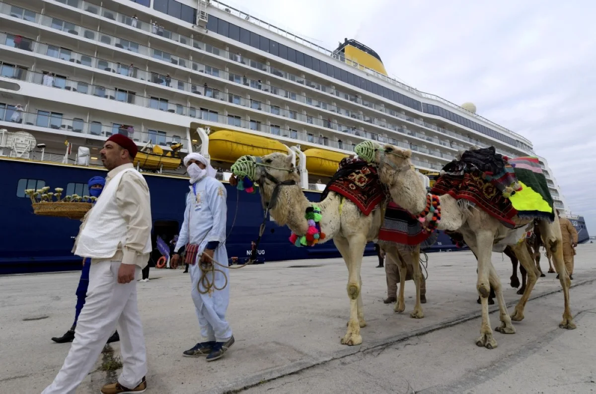 TUNIS: Tunisian men lead camels at the port of La Goulette in Tunis as Tunisia welcomes cruise ship from Europe, with more than 800 tourists on board.- AFP