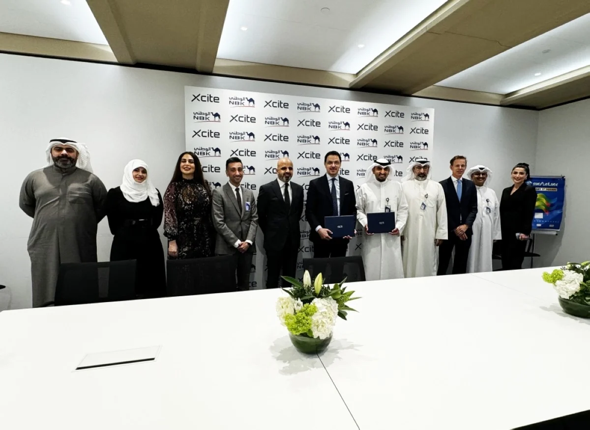 KUWAIT: Officials of National Bank of Kuwait (NBK) and X-cite by Alghanim Electronics after signing the partnership deal.