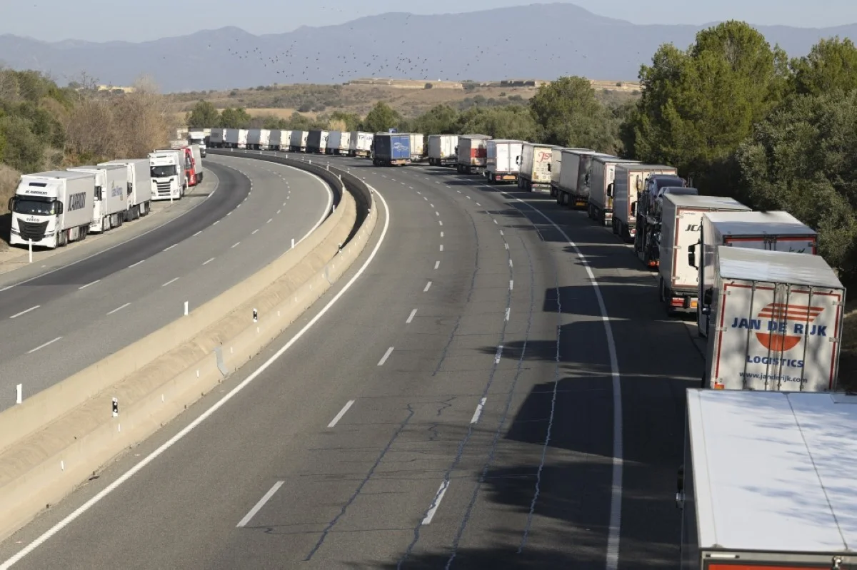 VILAJOAN, Spain: Trucks parked on the hard shoulder line up along the AP-7 motorway, close to Vilajoan, 35km to the French border, due to the A-9 blocade in France by protesting farmers, on Jan 27, 2024. -- AFP

