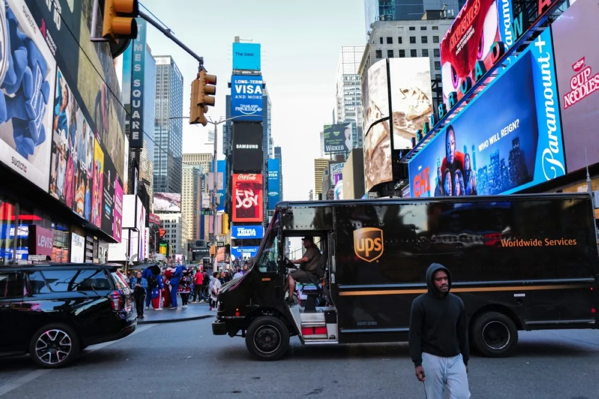 NEW YORK: A UPS truck driver maneuvers his delivery truck through Times Square in the Manhattan borough of New York on May 1, 2024. -- AFP