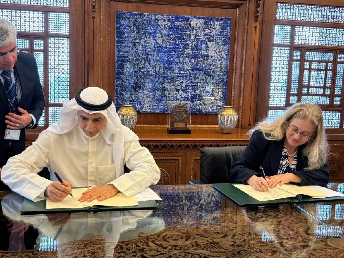 KUWAIT: Bader Al-Saad (left) and Hela Cheikhrouhou during the signing of the agreement.