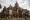 This photo shows a man riding past a temple in Bagan.