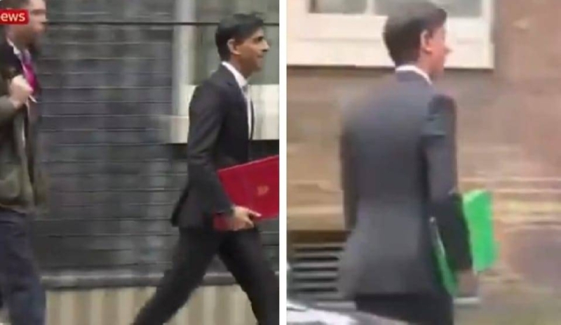 "أشبه بالسحر".. شاهد: رئيس وزراء بريطانيا الجديد يحمل ملف أحمر يتحول فجأة للأخضر