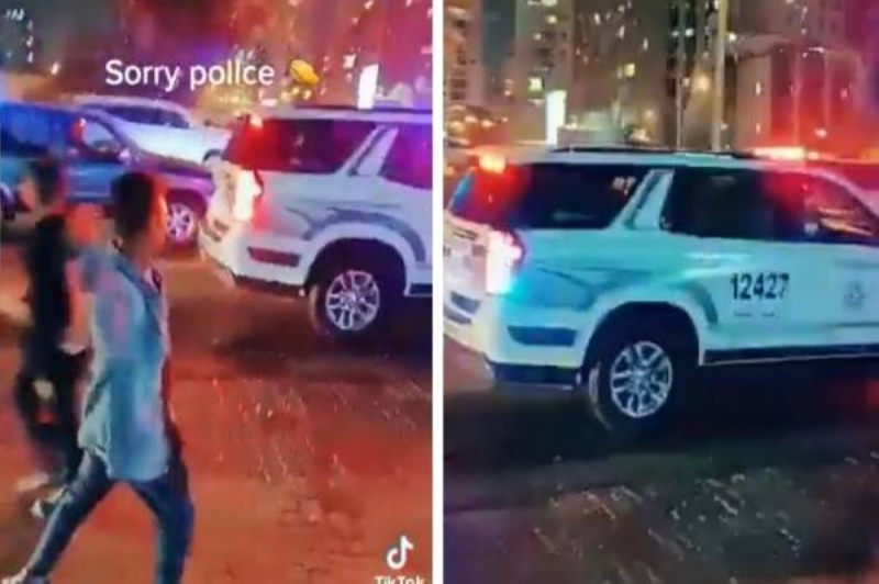 شاهد: وافد آسيوي في الكويت يتحدى زملائه ويقذف سيارة شرطة ببالونة ماء
