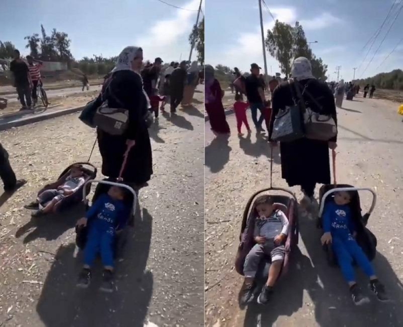 شاهد.. أم فلسطينية تجر أطفالها أثناء نزوحها إلى جنوب غزة هربا من القصف الإسرائيلي