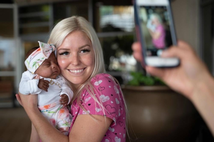TOPSHOT - In this picture received by AFP from Sharp Mary Birch Hospital for Women & Newborns on May 29, 2019, shows a nurse holding baby Saybie, the world's smallest surviving newborn, on the day she was released from the NICU in San Diego, California. - A baby girl who weighed 245 grams and measured 23 cm became the smallest baby in the world, a US hospital reported after being discharged five months after being in intensive care. (Photo by HO / Sharp HealthCare. / AFP) / RESTRICTED TO EDITORIAL USE - MANDATORY CREDIT 