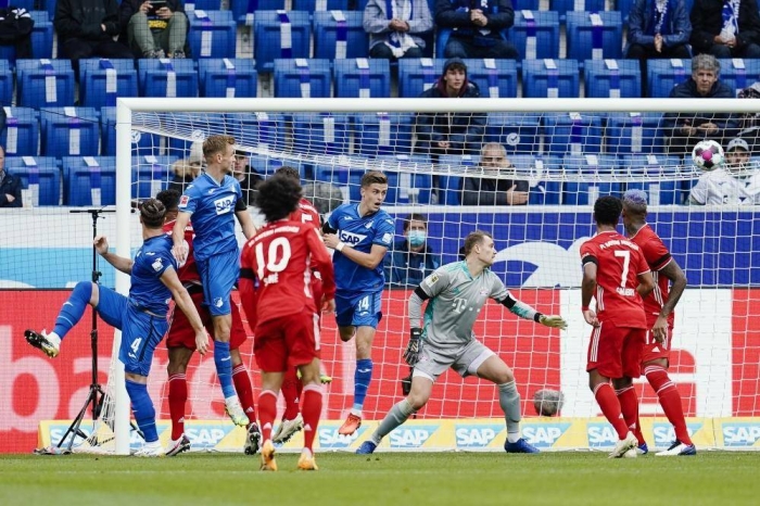 27 September 2020, Baden-Wuerttemberg, Sinsheim: Hoffenheim's Ermin Bicakcic scores his side's first goal past Munich goalkeeper Manuel Neuer during the Germn Bundesliga soccer match between 1899 Hoffenheim and Bayern Munich at the PreZero-Arena. Photo: Uwe Anspach/dpa - IMPORTANT NOTICE: DFL and DFB regulations prohibit any use of photographs as image sequences and/or quasi-video.