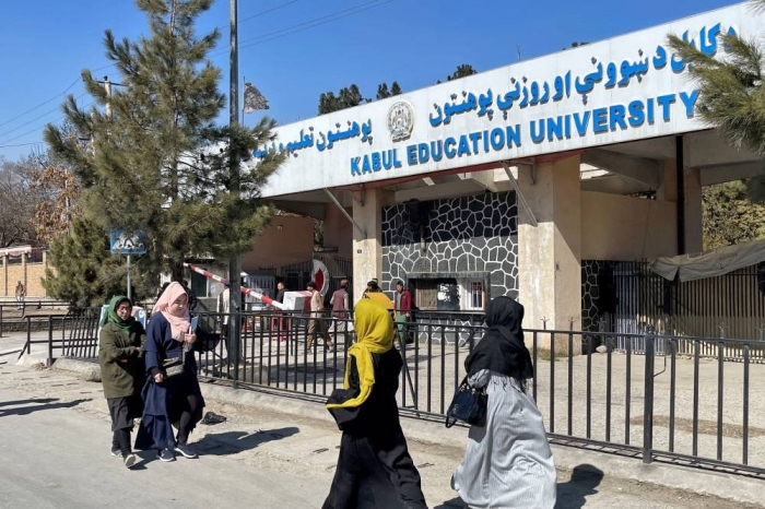 FILE PHOTO: Female students walk in front of the Kabul Education University in Kabul, Afghanistan, February 26, 2022. REUTERS/Stringer/File Photo