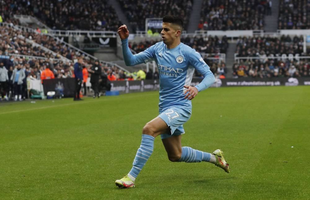 Soccer Football - Premier League - Newcastle United v Manchester City - St James' Park, Newcastle, Britain - December 19, 2021 Manchester City's Joao Cancelo celebrates scoring their second goal Action Images via Reuters/Lee Smith