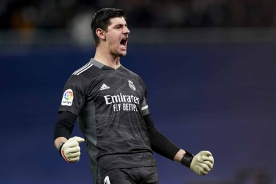 MADRID, SPAIN - DECEMBER 12: Thibaut Courtois of Real Madrid celebrates during the La Liga Santander match between Real Madrid CF and Club Atletico de Madrid at Estadio Santiago Bernabeu on December 12, 2021 in Madrid, Spain. (Photo by Mateo Villalba/Quality Sport Images/Getty Images)