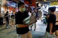 الصين : فيروس كورونا موجود في عبوات مأكولات بحرية