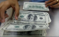 «النقد الدولي» تراجع حصة الدولار من الاحتياطيات العالمية