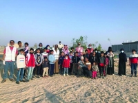 100 طفل و «أب» يشاركون في تشجير حديقة ضاحية هجر