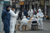الصين تسجل 103 إصابات جديدة بكورونا