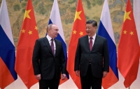 الرئيس الروسي فلاديمير بوتين يحضر اجتماعا مع الرئيس الصيني شي جين بينغ في بكين مطلع 2022 - رويترز