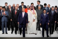 قادة مجموعة الدول العشرين خلال اجتماع سابق - رويترز