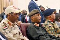 رئيس مجلس السيادة السوداني ونائبه بحفل توقيع الاتفاق الإطاري - رويترز