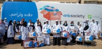 موظفو anb يشاركون في قافلة "كسوة الشتاء" في الرياض وتبوك وعرعر