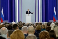 الرئيس الروسي فلاديمير بوتين يتحدث أمام أعضاء برلمان بلاده- رويترز