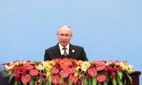 بوتين متحدثًا خلال مؤتمر صحفي في بكين - د ب أ