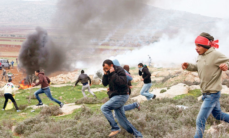 فلسطينيون يتظاهرون ضد المستوطنات الإسرائيلية شمال رام الله
