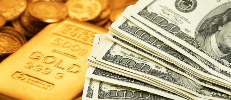 الذهب يتراجع مع صعود الدولار والأنظار على الفائدة الأمريكية