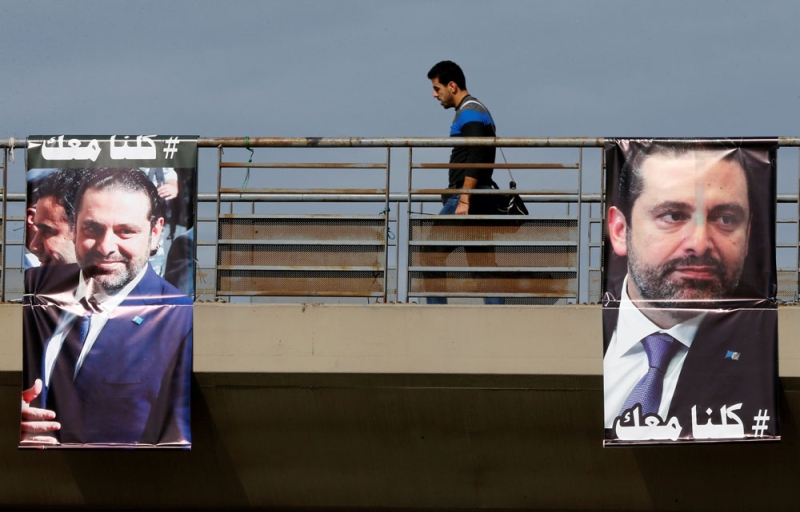 شوارع بيروت ترتدي صور الحريري تأييدا لقراراته (رويترز)