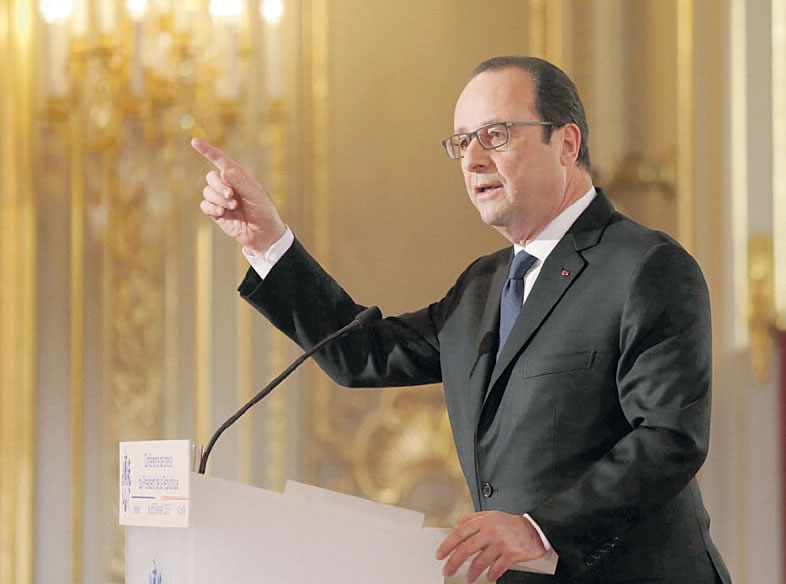  الرئيس الفرنسي فرنسوا هولاند أثناء مؤتمره الصحافي