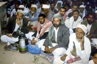  المتمرد الحوثي مع مجموعة من اتباعه في صعدة