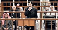 صدام حسين خلال إحدى الجلسات