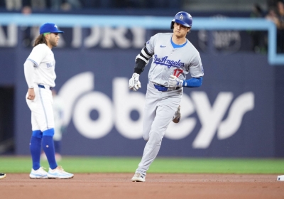 Los Angeles Dodgers designated hitter Shohei Ohtani runs the bases after hitting a home run against the Toronto Blue Jays during the first inning at Rogers Centre in Toronto on Friday.